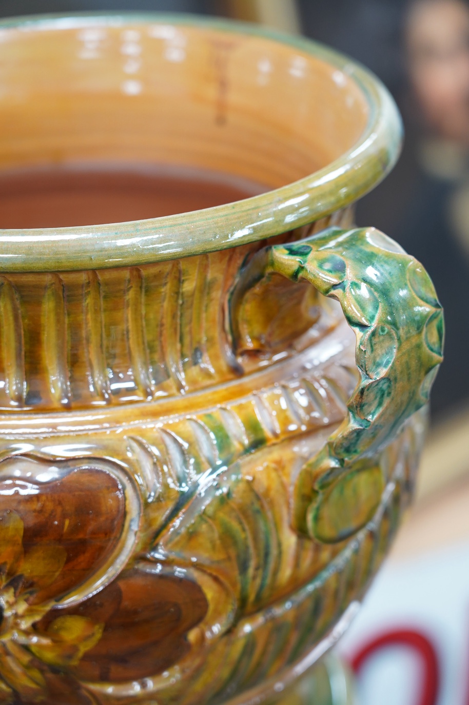 A terracotta jardiniere on stand with incised stylised floral decoration, 102cm high. Condition - good